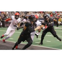 Arizona Rattlers Quarterback Jeff Ziemba avoids pressure from the Sioux Falls Storm