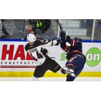 Vancouver Giants Defenseman Bowen Byram collides with a Kamloops Blazer