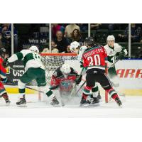 Kelowna Rockets Goaltender Brodan Salmond tires to fight off the Everett Silvertips