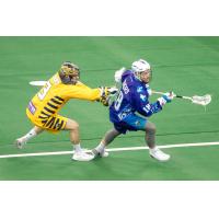 Jake Withers of the Rochester Knighthawks keeps possession against the Georgia Swarm