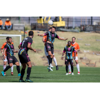 Las Vegas Lights FC Midfielder Carlos Alvarez battles Orange County SC for possession