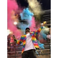 Charleston RiverDogs fans pelt the emcee with colored corn starch during Joseph P. Riley, Jr. and the Amazing Technicolor Ballpark Night