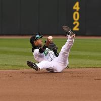 Dayton Dragons' Jose Garcia throws out a runner at second after a diving stop in the first inning