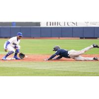 Errol Robinson of the Tulsa Drillers attempts to tag out a base runner in Sunday's game at ONEOK Field