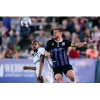 Colorado Springs Switchbacks battle for a ball against Fresno FC