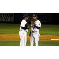 Tri-City Dust Devils confer on the mound