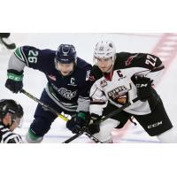 Vancouver Giants right wing Jared Dmytriw (right) faces off with the Seattle Thunderbirds