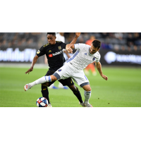 Dan Jose Earthquakes midfielder Vako (right) battles for possession with LAFC's Latif Blessing