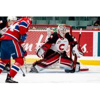 Prince George Cougars goaltender Taylor Gauthier tips aside a Spokane Chiefs' shot