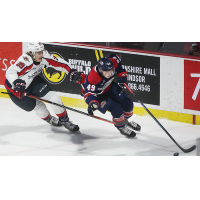 Saginaw Spirit right wing Cole Coskey (right) vs. the Windsor Spitfires