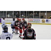 Port Huron Prowlers exchange greetings with the Mentor Ice Breakers