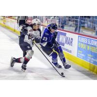 Vancouver Giants defenceman Tanner Brown (left) prepares to deliver a hit against the Victoria Royals
