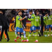 Seattle Sounders FC exchange congratulations after clinching a playoff berth