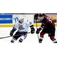 Victoria Royals right wing Anthony Wilson (left) vs the Vancouver Giants