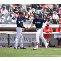 Josh Breaux of the Somerset Patriots receives a handshake following his home run