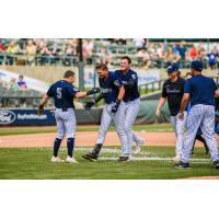 Somerset Patriots first baseman TJ Rumfield is congratulated by teammates