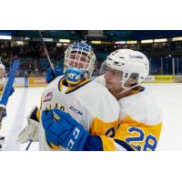 Saskatoon Blades' Evan Gardner and Lukas Hansen celebrate win