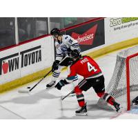 Wenatchee Wild's Briley Wood and Kelowna Rocket's Caden Price in action