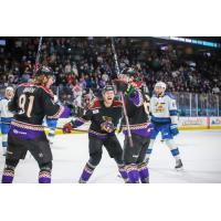 Tucson Roadrunners forwards Josh Doan, Jan Jenik, and Colin Theisen celebrate Josh Doan's game winning goal