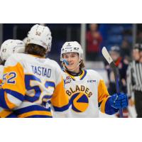 Saskatoon Blades' Morgan Tastad congratulates Rhett Melnyk