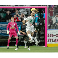 St. Louis Ambush forward William Eskay (right) heads the ball vs. the Dallas Sidekicks