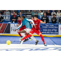 Kansas City Comets' Eduardo Alonso Alejo and Henry Ramirez battle St. Louis Ambush's Marcel Berry