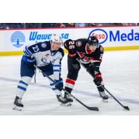 Belleville Senators centre Brennan Saulnier (right) vs. the Manitoba Moose