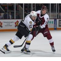 Kingston Frontenacs' Matthew Soto battles Peterborough Petes' Caden Taylor