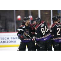 Tucson Roadrunners' Montana Onyebuchi, Max Szuber, and Patrik Koch on game night