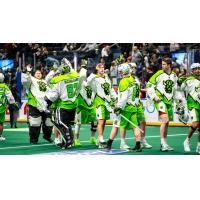 Saskatchewan Rush exchange high fives following a win