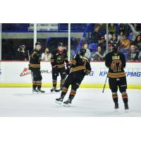 Vancouver Giants gather after a goal against the Spokane Chiefs