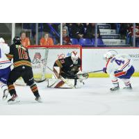 Vancouver Giants goaltender Brett Mirwald stops a shot against the Spokane Chiefs