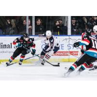 Kelowna Rockets left wing Ty Hurley (left) vs. the Tri-City Americans