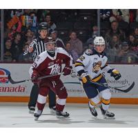 Peterborough Petes' Braydon McCallum and Erie Otters' Bruce McDonald on the ice