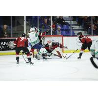 Vancouver Giants' Ty Halaburda, Brett Mirwald, and Mazden Leslie battle Seattle Thunderbirds' Caleb Potter