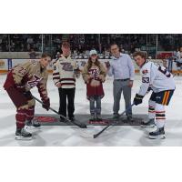 Peterborough Petes' Jonathan Melee, Barrie Colts' Beau Jelsma, and Petes' Real Canadian Superstore winning jersey designer Hana Bates-Keegan on game night