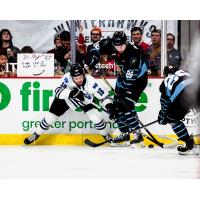 Wenatchee Wild's Maddix McCagherty battles Portland Winterhawks' Marek Alscher and Josh Zakreski