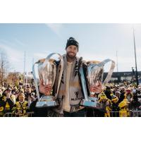 Josh Williams holds the MLS Cups won by the Columbus Crew