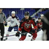 Tri-City Americans' Carter MacAdams and Vancouver Giants' Jaden Lipinski on the ice