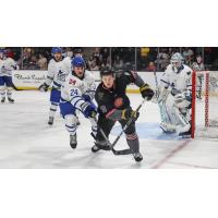 Wichita Thunder defenseman Nolan Kneen (left) vs. the Iowa Heartlanders