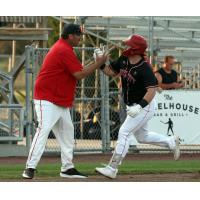 Sioux City Explorers' Field Manager Steve Montgomery congratulates John Nogowski