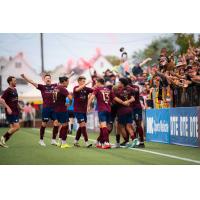 Detroit City FC celebrates a goal in front of their crowd