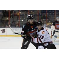 Rapid City Rush forward Ryan Wagner (right) vs. the Kansas City Mavericks