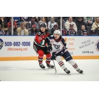 Kelowna Rockets' Hiroki Gojsic and Tri-City Americans' Cash Koch in action