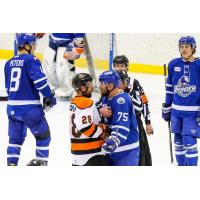 Wichita Thunder defenseman Mathieu Gagnon (right) faces off with the Fort Wayne Komets