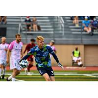 Forward Madison FC goalkeeper Chris Brady