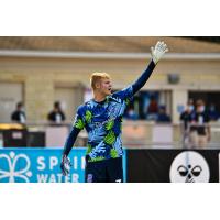 Forward Madison FC goalkeeper Chris Brady