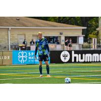 Forward Madison FC goalkeeper Chris Brady