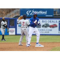 Luis De Los Santos of the Syracuse Mets on base