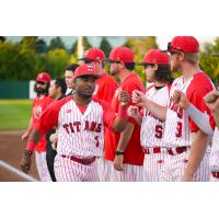 Ottawa Titans exchange fist bumps before a game